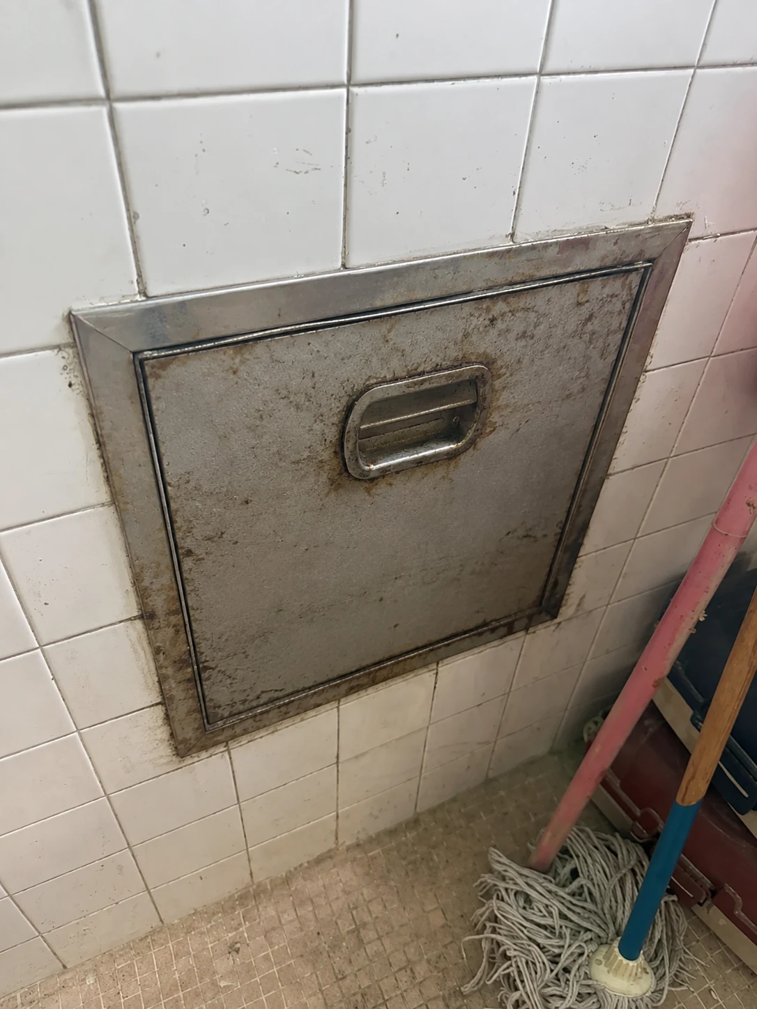 Before: condo rubbish chute prior to replacement