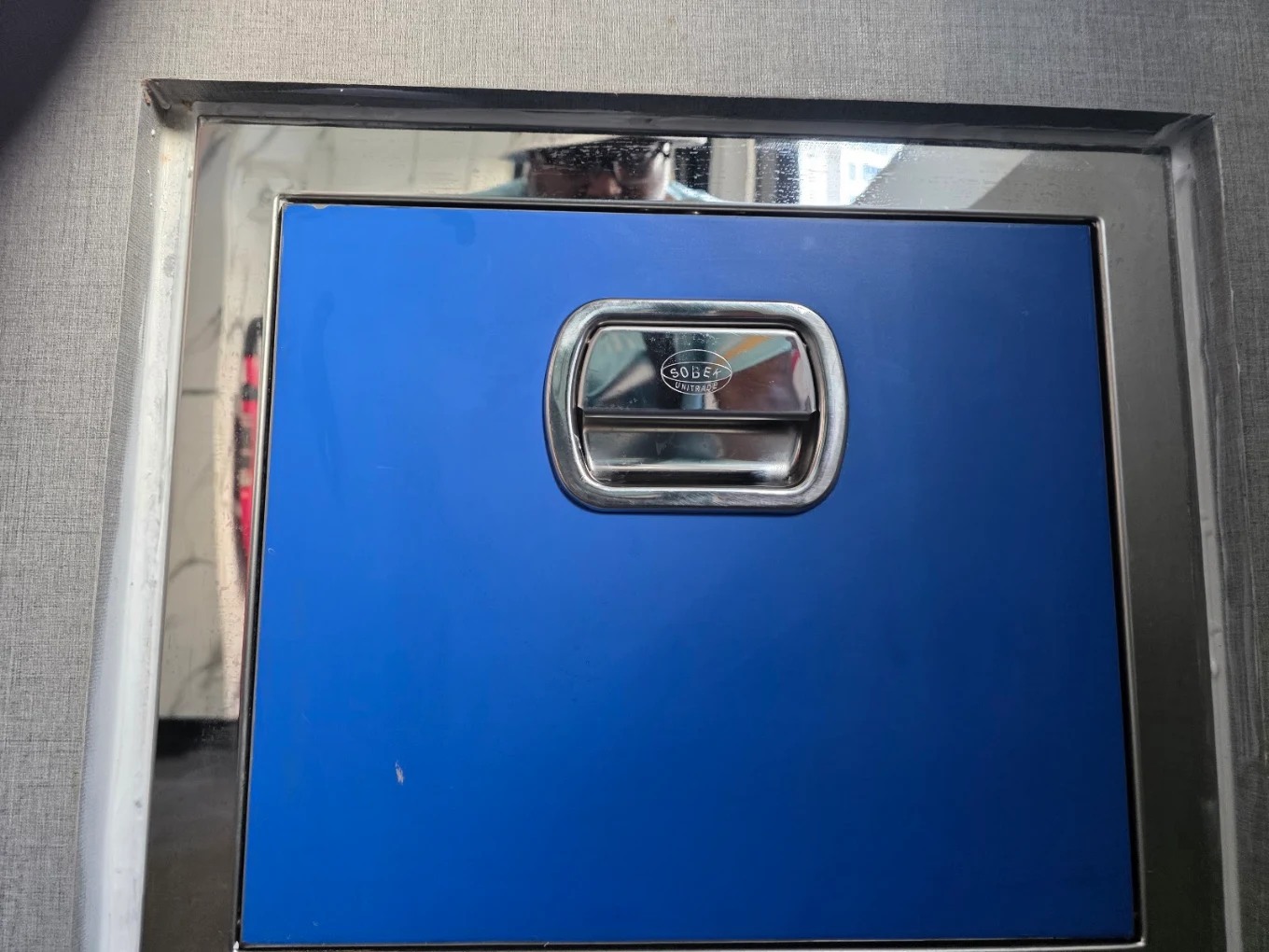 Rubbish chute hopper door, yellow panel installed in cabinet